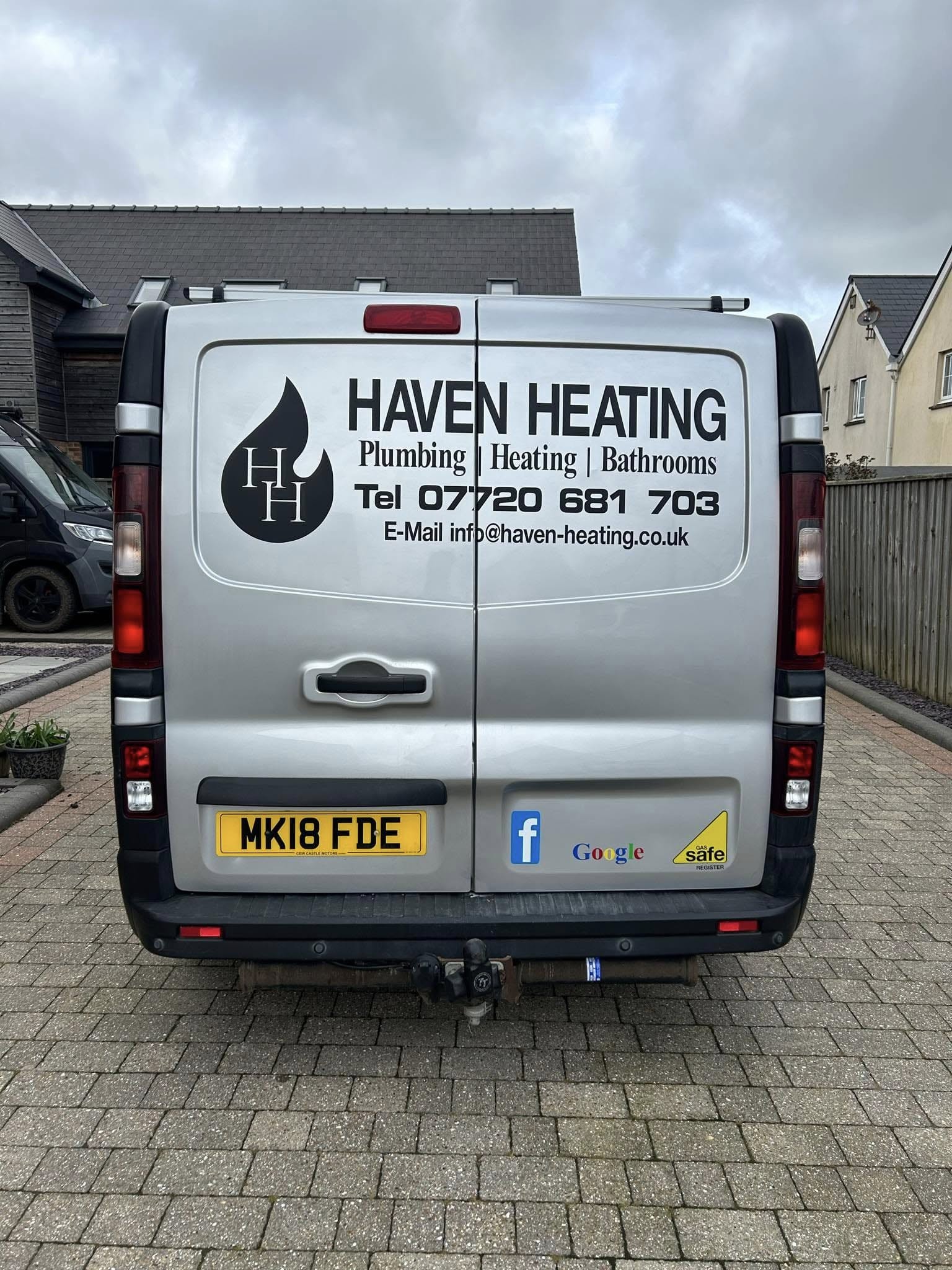 Haven Heating van parked in house driveway